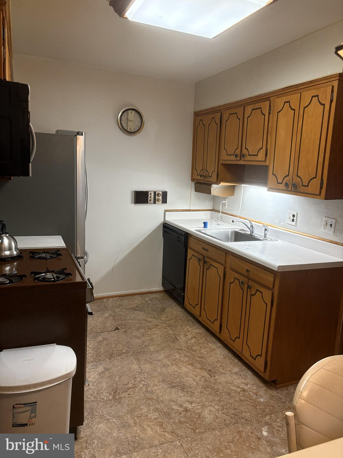 4523 Kinmount Road Lanham, MD 20706 - Photo 14 of 38 a bathroom with a granite countertop toilet sink and mirror