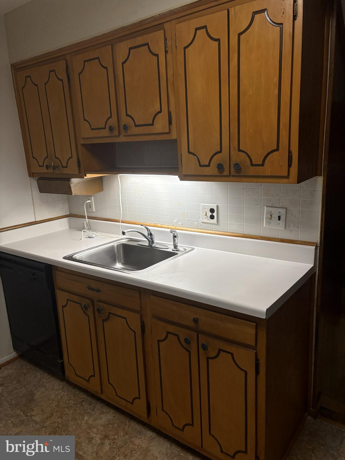 4523 Kinmount Road Lanham, MD 20706 - Photo 18 of 38 a kitchen with a sink a cabinets and a window