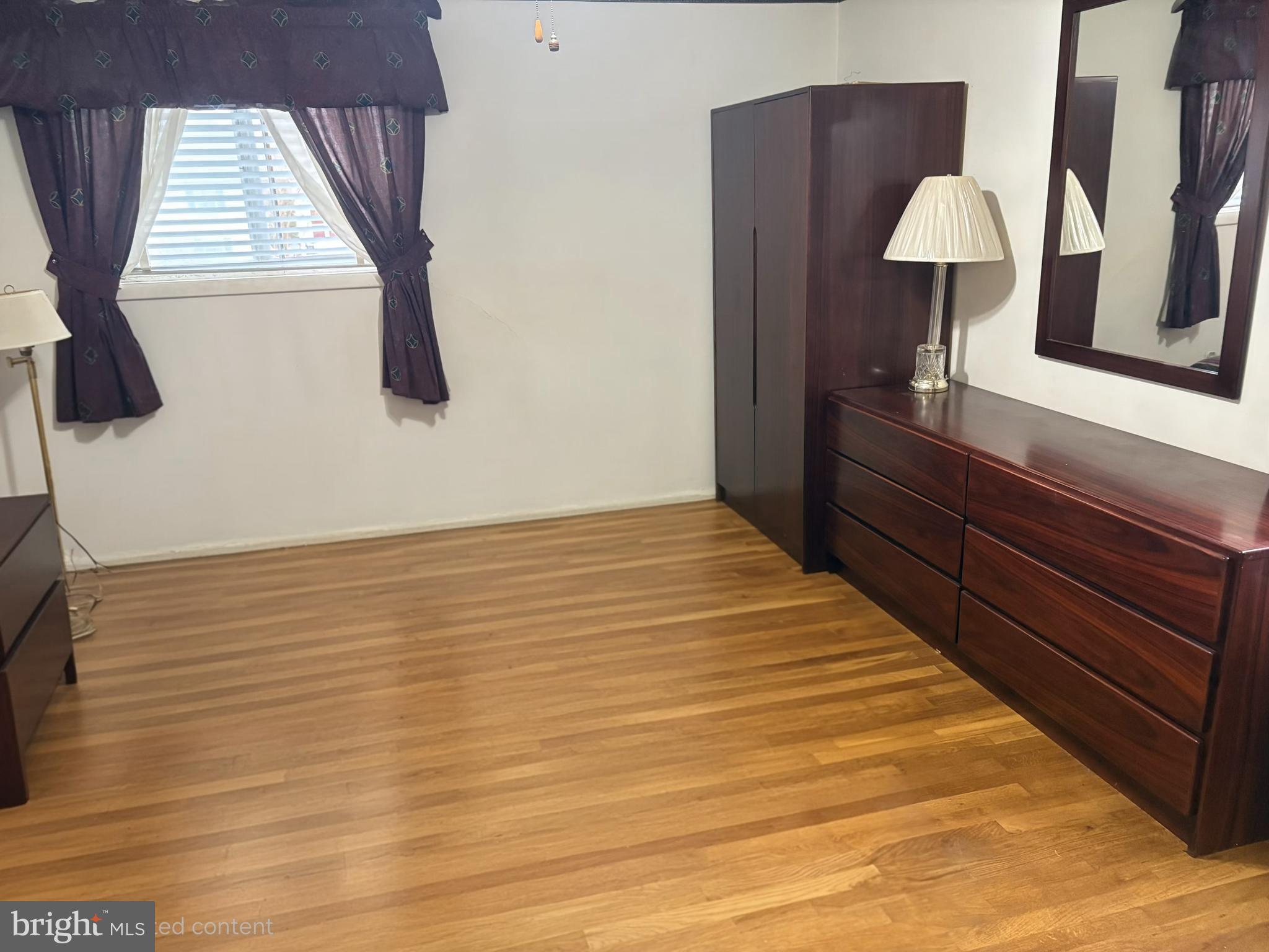 4523 Kinmount Road Lanham, MD 20706 - Photo 24 of 38 a bedroom with a bed and a window