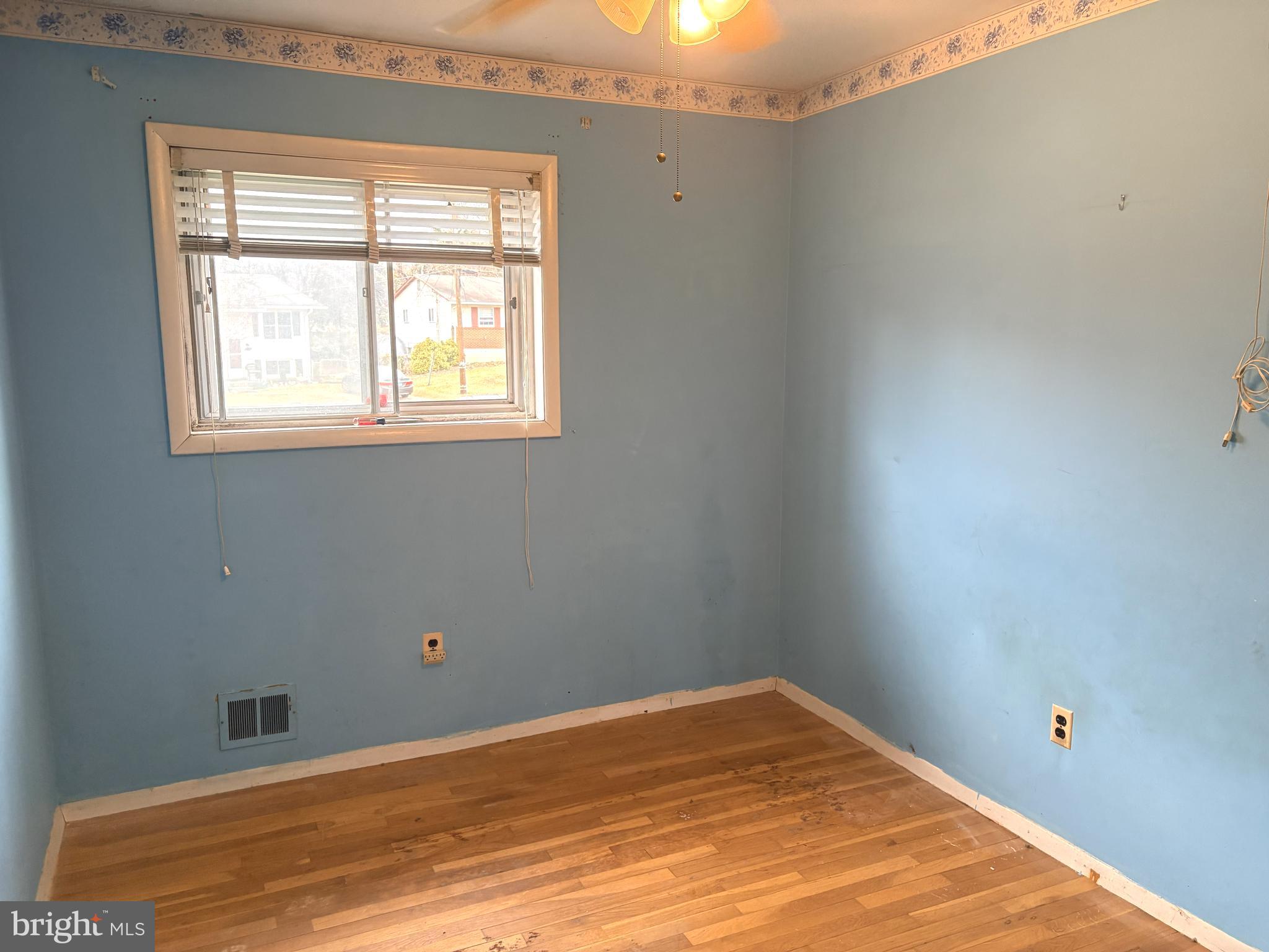4523 Kinmount Road Lanham, MD 20706 - Photo 26 of 38 a view of a room with a wooden floor and a window