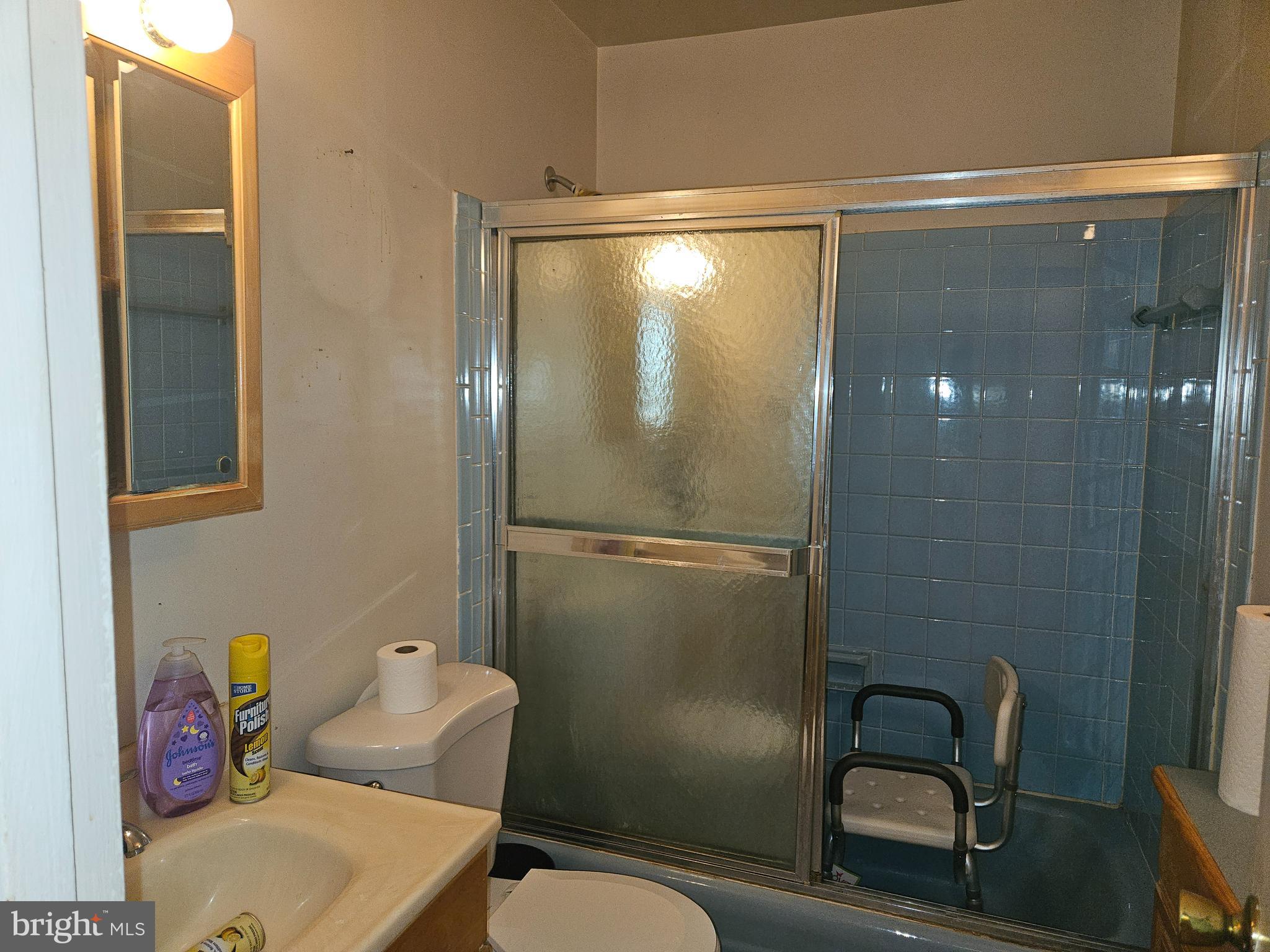 4523 Kinmount Road Lanham, MD 20706 - Photo 30 of 38 a bathroom with a granite countertop shower sink and toilet