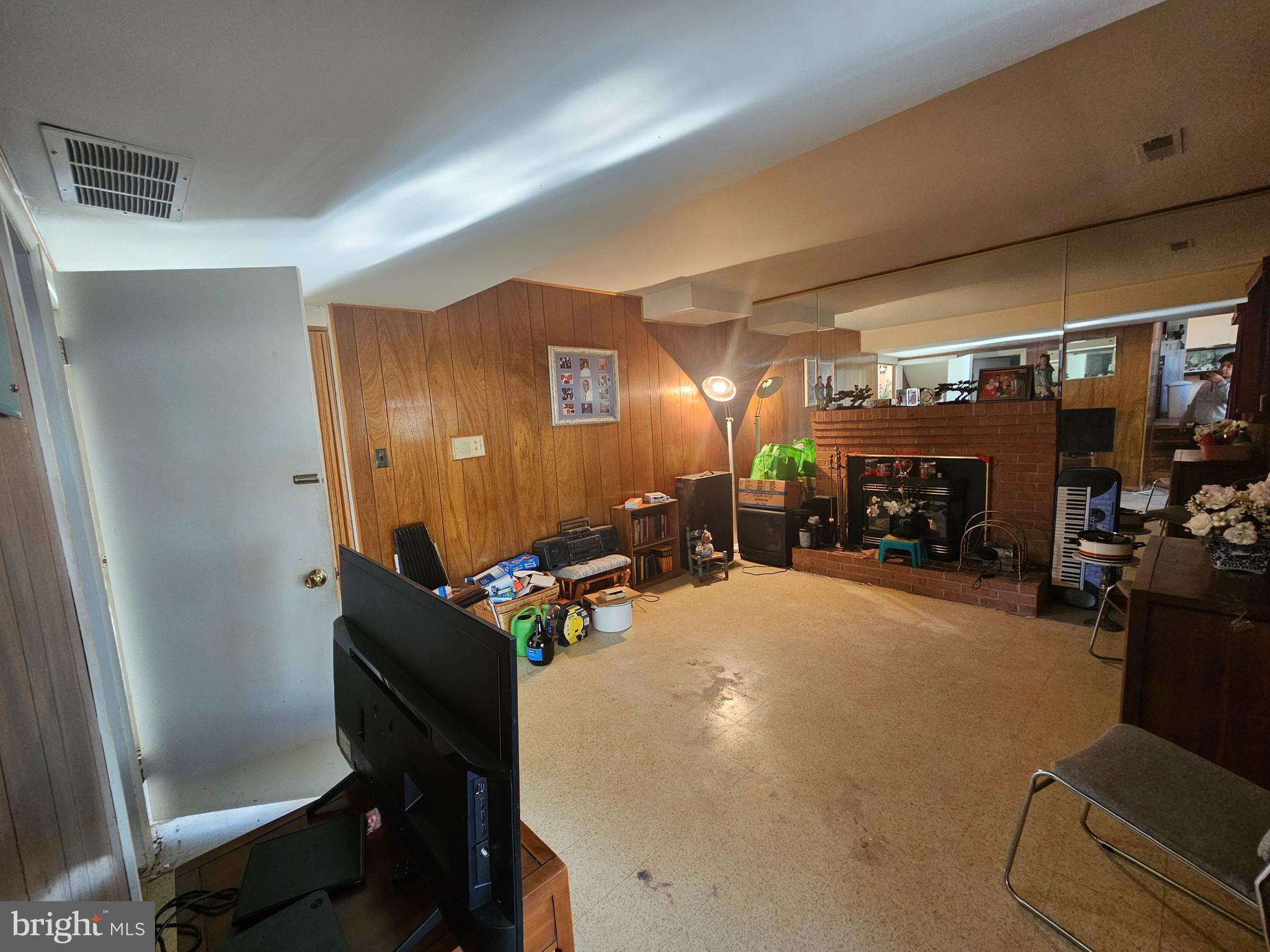 4523 Kinmount Road Lanham, MD 20706 - Photo 35 of 38 a room with furniture and a flat screen tv