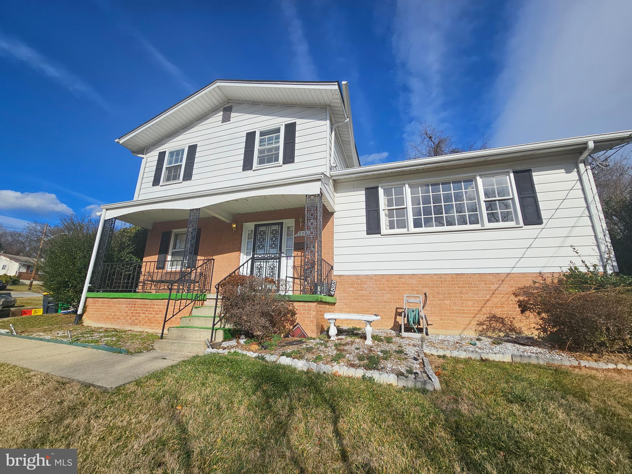 4523 Kinmount Road Lanham, MD 20706 - Photo 4 of 38 a front view of a house with a yard