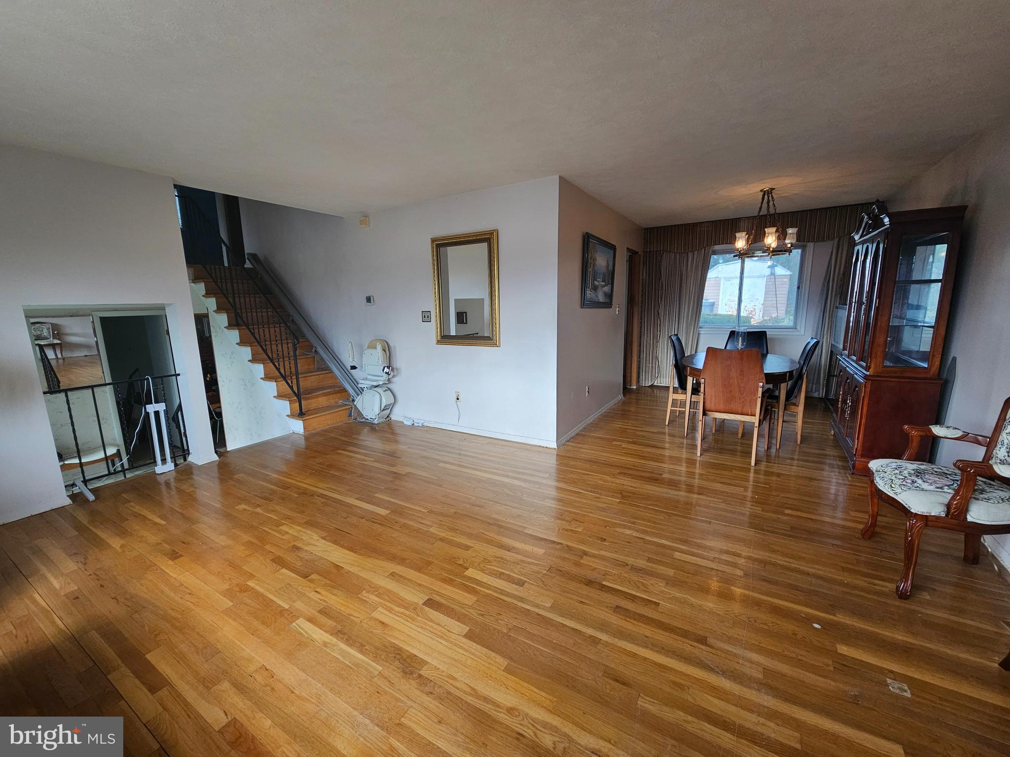 4523 Kinmount Road Lanham, MD 20706 - Photo 7 of 38 a living room with fireplace furniture and a wooden floor