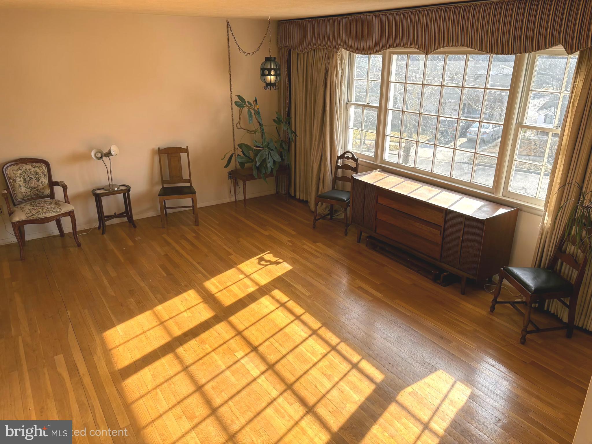 4523 Kinmount Road Lanham, MD 20706 - Photo 9 of 38 a spacious bedroom with a bed and a table