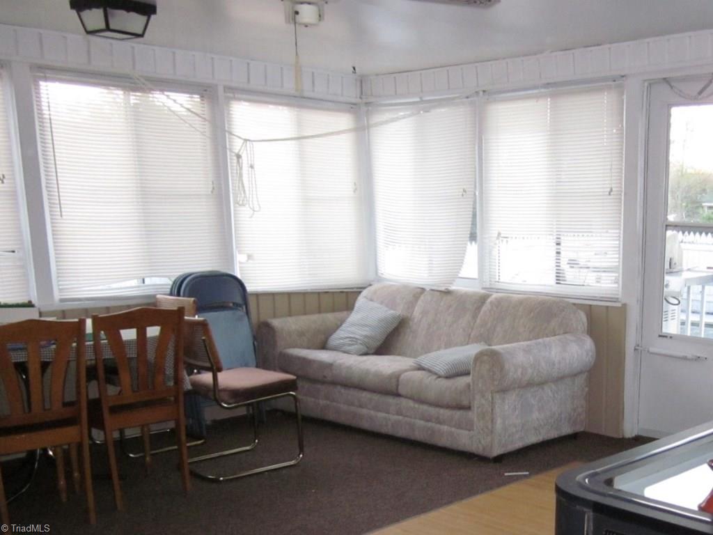 2991 Hickory Tree Road Winston-Salem, NC 27127 - Photo 16 of 26 Large sunroom on main level doubles as a playroom.