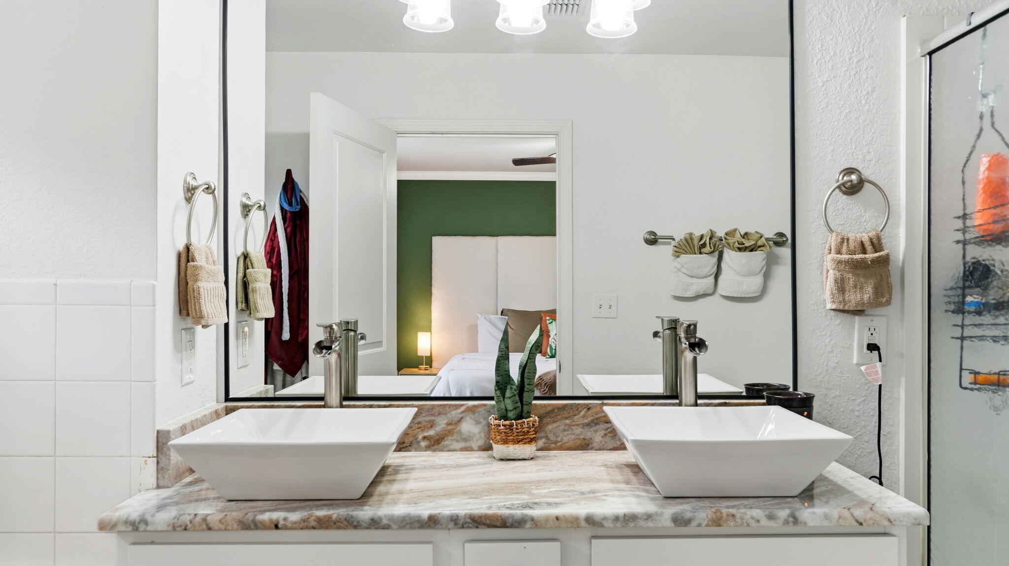 22 North Sand Palm Road, Unit 15 Freeport, FL 32439 - Photo 17 of 40 a large white bathroom with a granite countertop sink and a mirror