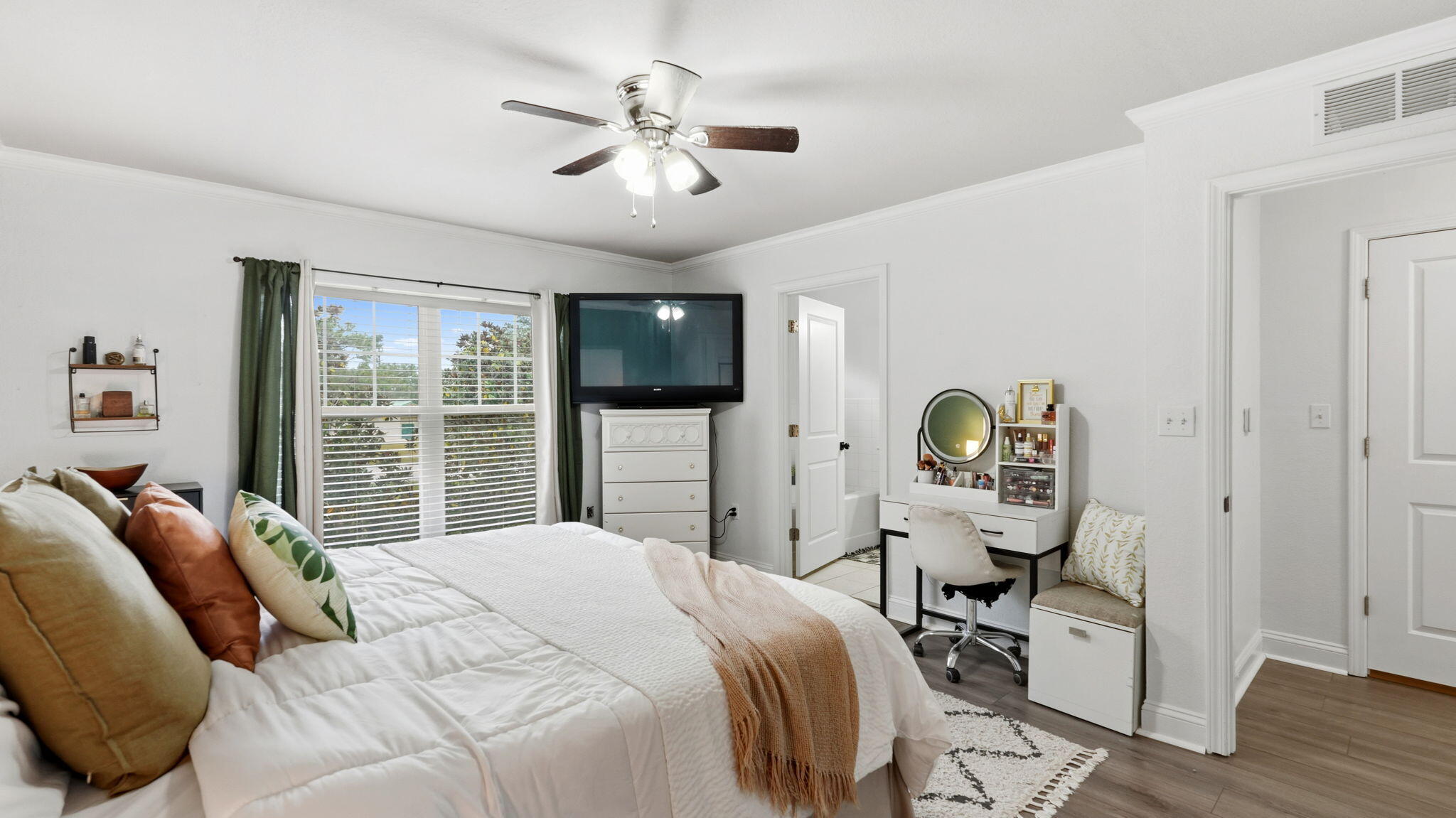 22 North Sand Palm Road, Unit 15 Freeport, FL 32439 - Photo 18 of 40 a bedroom with a bed a chandelier and a flat tv screen