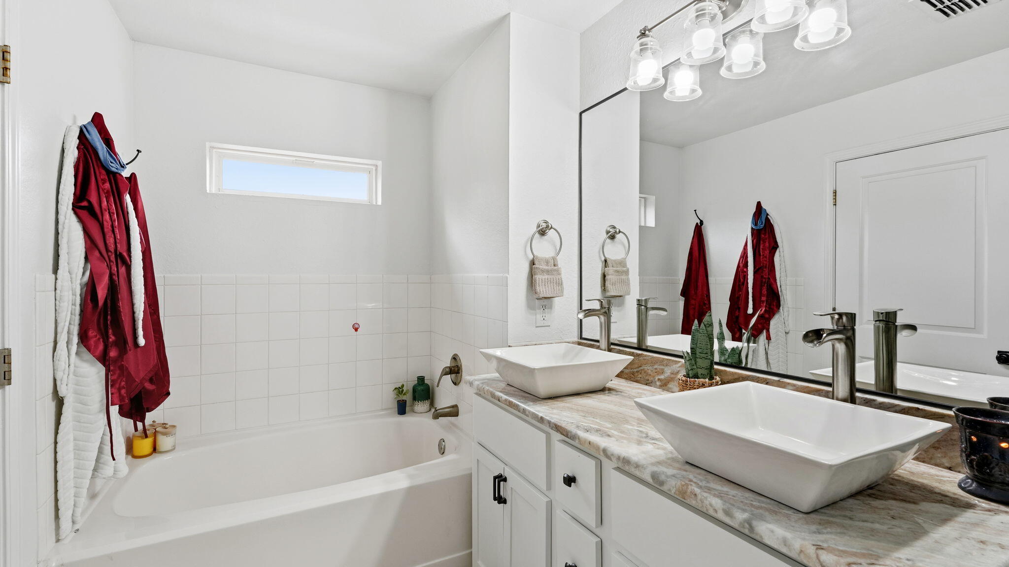22 North Sand Palm Road, Unit 15 Freeport, FL 32439 - Photo 20 of 40 a bathroom with a sink vanity tub and a mirror