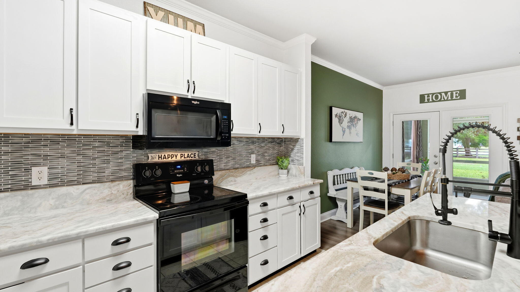 22 North Sand Palm Road, Unit 15 Freeport, FL 32439 - Photo 6 of 40 a kitchen with stainless steel appliances a stove a sink a microwave a refrigerator and cabinets