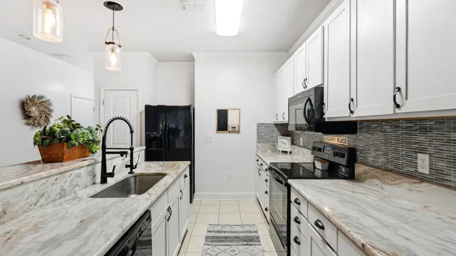 a view of a dining room with furniture and a window