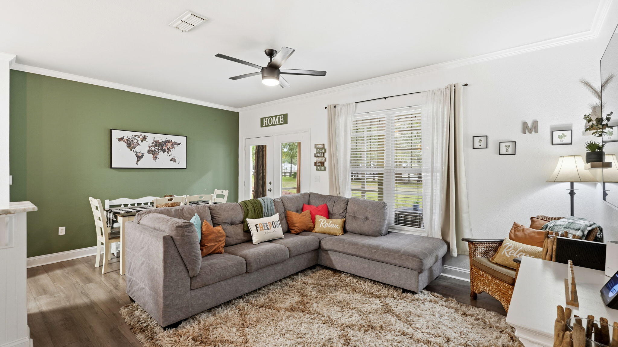 22 North Sand Palm Road, Unit 15 Freeport, FL 32439 - Photo 9 of 40 a living room with furniture and a large window
