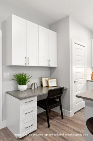 a view of cabinets and wooden floor