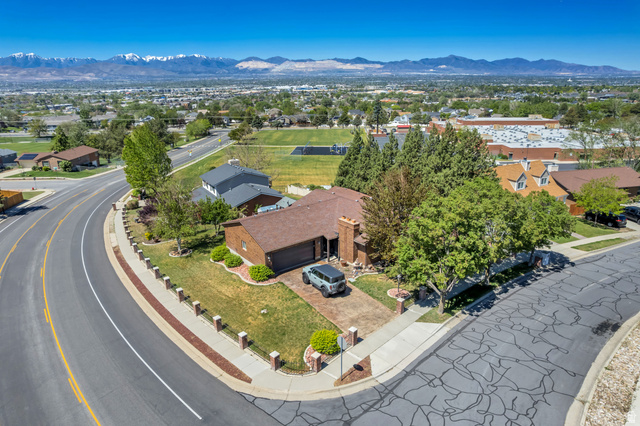 12080 Mill Ridge Circle Sandy, UT 84094 - Photo 51 of 56 Single-story brick exterior home with an attached garage, situated on a corner lot