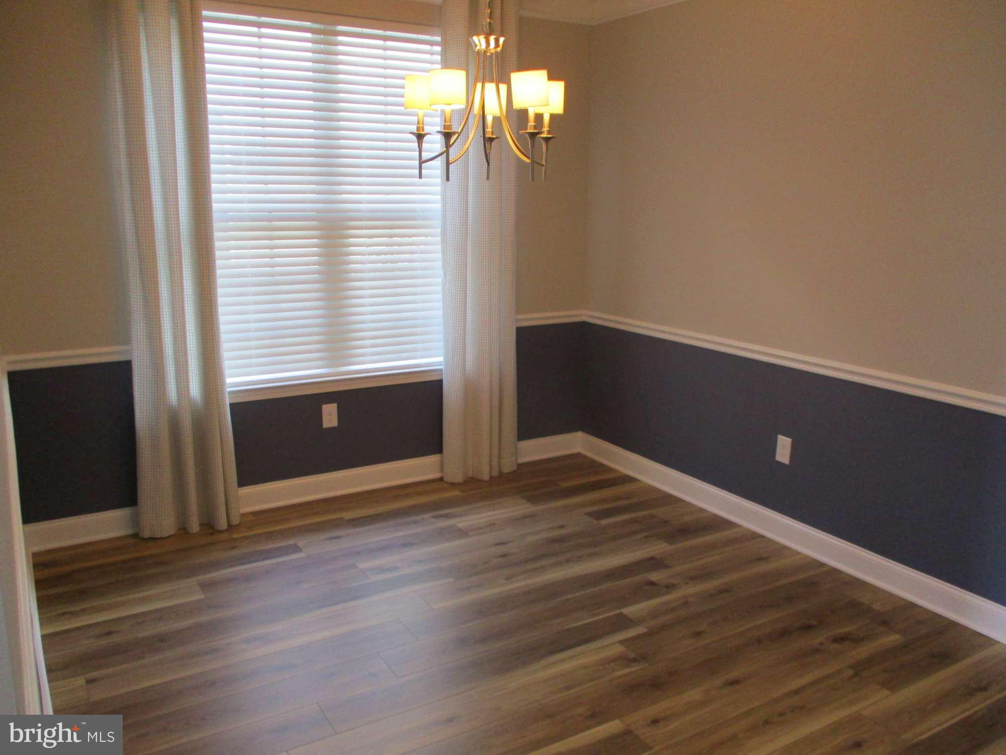 3 Montclaire Road Medford, NJ 08055 - Photo 11 of 23 a view of an empty room with wooden floor and a window