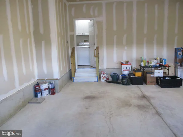 wooden floor in a room with a large window