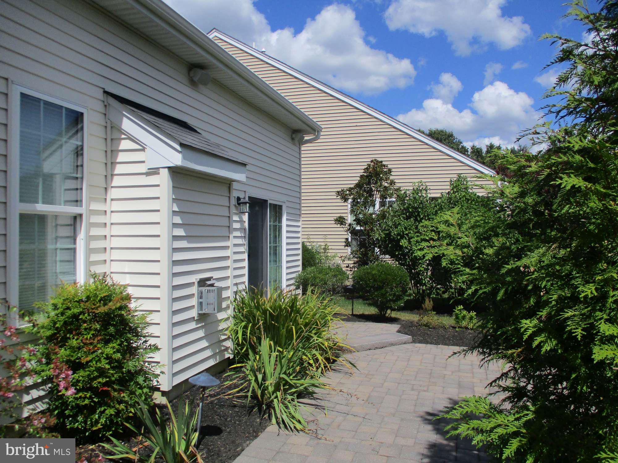 3 Montclaire Road Medford, NJ 08055 - Photo 3 of 23 a view of a house with potted plants and a large tree