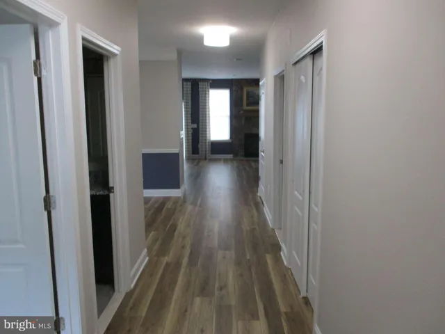 a view of gallery with wooden floor