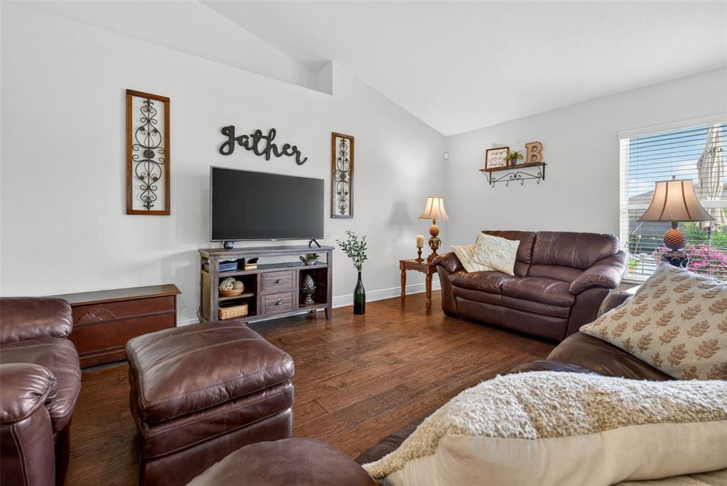 2429 Twin Lake View Road Winter Haven, FL 33881 - Photo 9 of 37 a living room with furniture and a flat screen tv