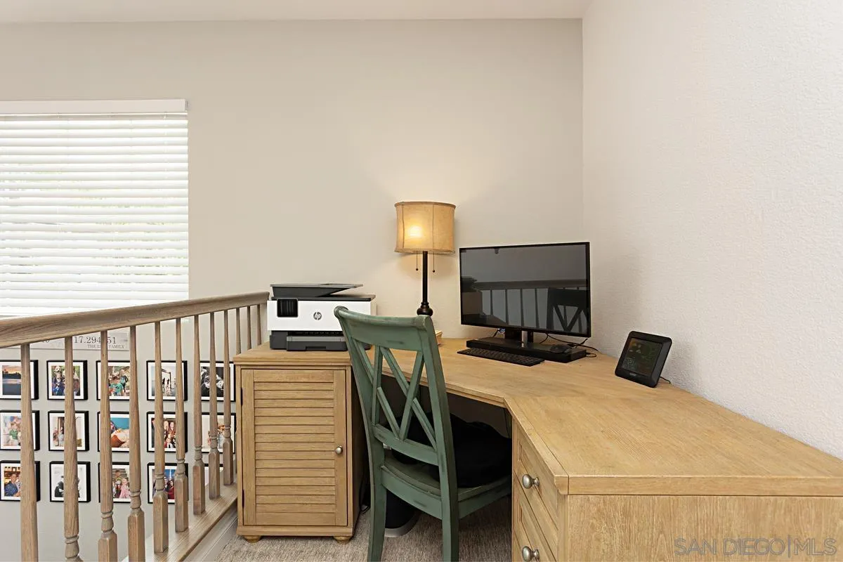 1058 Bells Drive Oceanside, CA 92057 - Photo 17 of 31 a bedroom with a bed and wooden floor