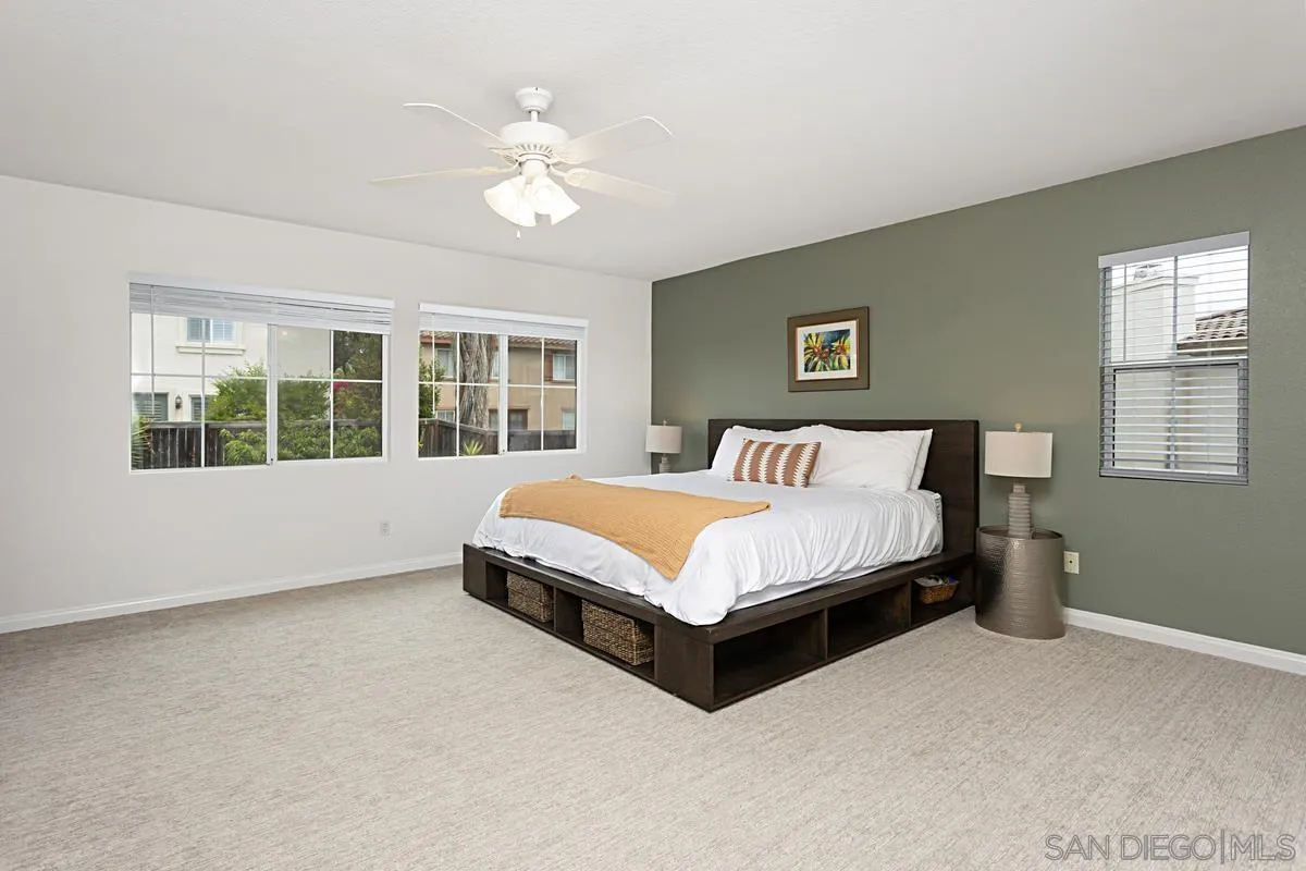 1058 Bells Drive Oceanside, CA 92057 - Photo 5 of 31 a bedroom with a large bed and a window