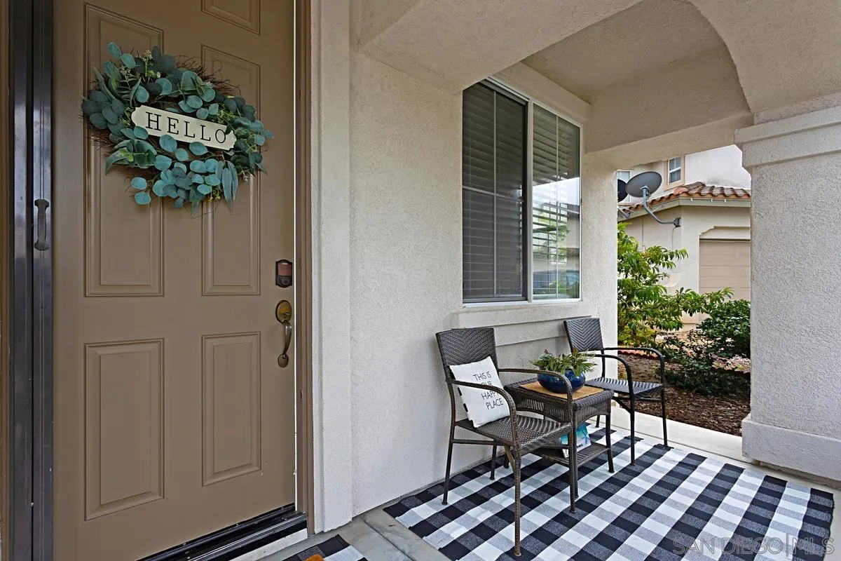 1058 Bells Drive Oceanside, CA 92057 - Photo 7 of 31 a dining room with furniture and a potted plant