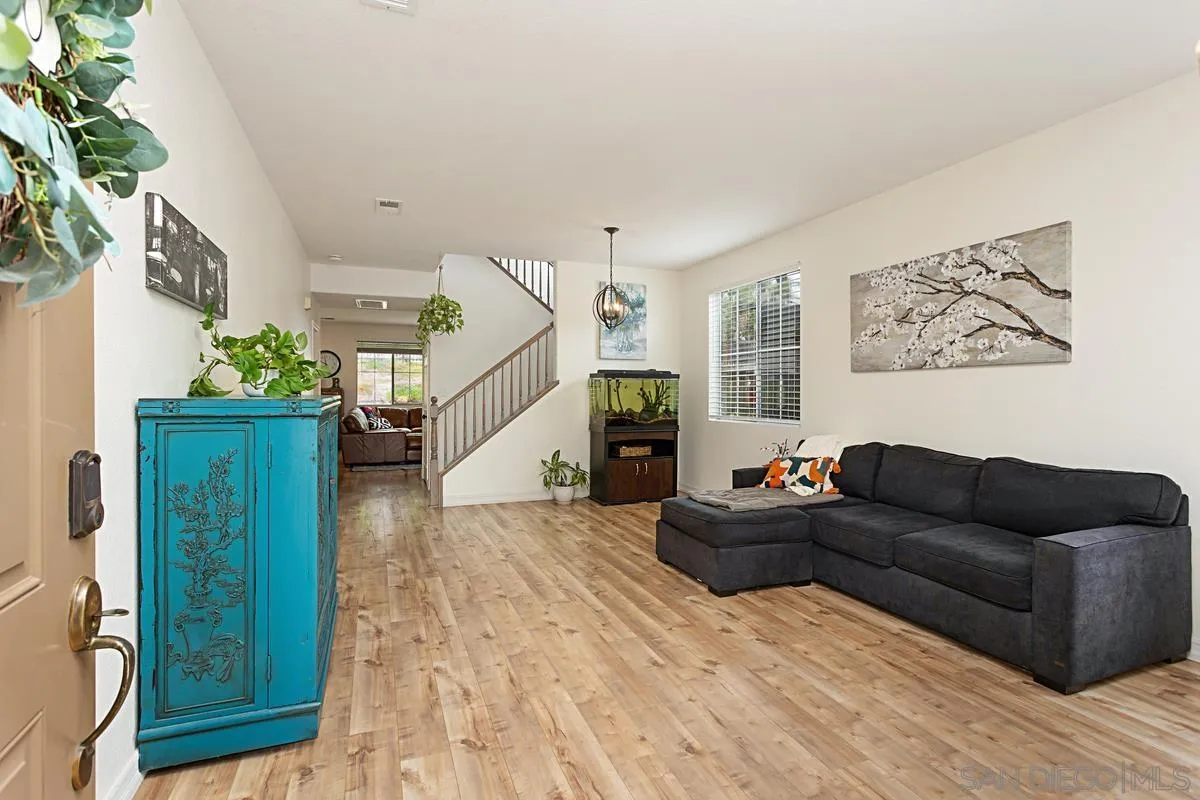 1058 Bells Drive Oceanside, CA 92057 - Photo 8 of 31 a living room with furniture and stairs