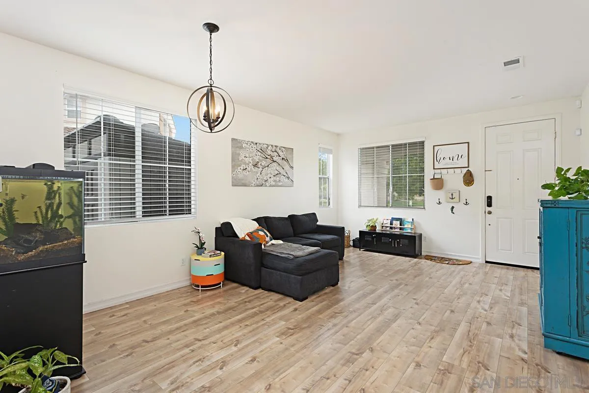 1058 Bells Drive Oceanside, CA 92057 - Photo 9 of 31 a living room with furniture window and wooden floor