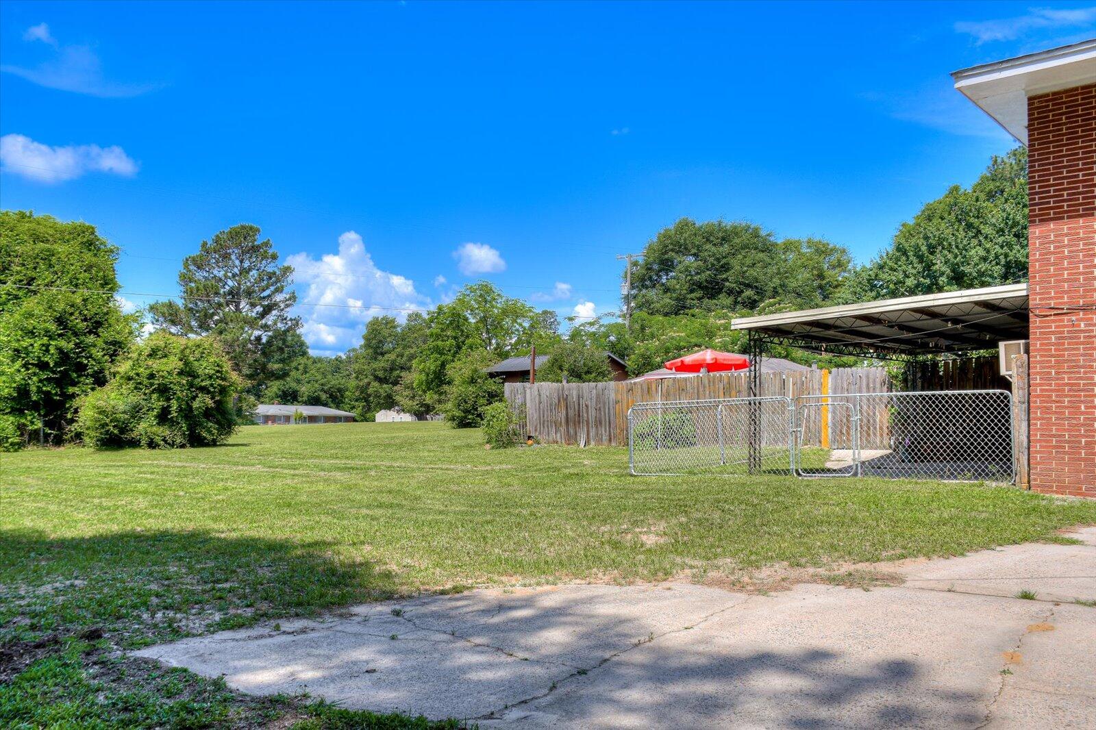 308 5th Street Jackson, SC 29831 - Photo 68 of 70 a small garden covered with tall trees