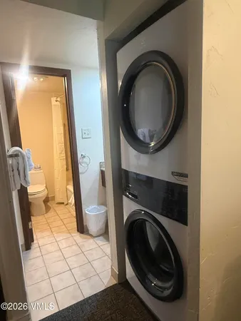 a close view of a utility room with dryer and washer