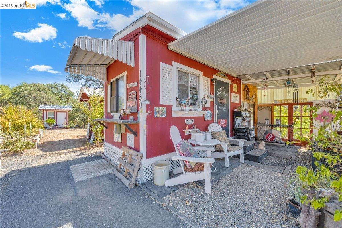 14450 Jacksonville Road Jamestown, CA 95327 - Photo 64 of 85 Red exterior with an awning over a serving window
