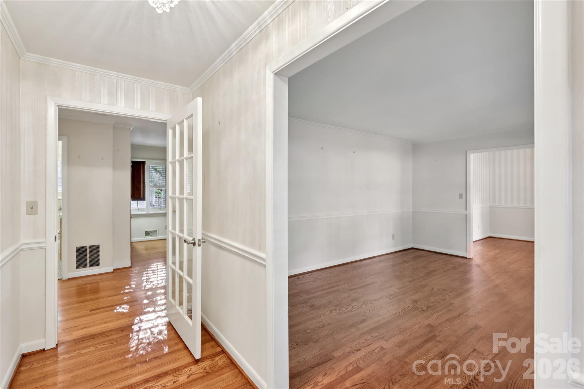 1002 Ridge Street Albemarle, NC 28001 - Photo 5 of 45 a view of a hallway with wooden floor and staircase