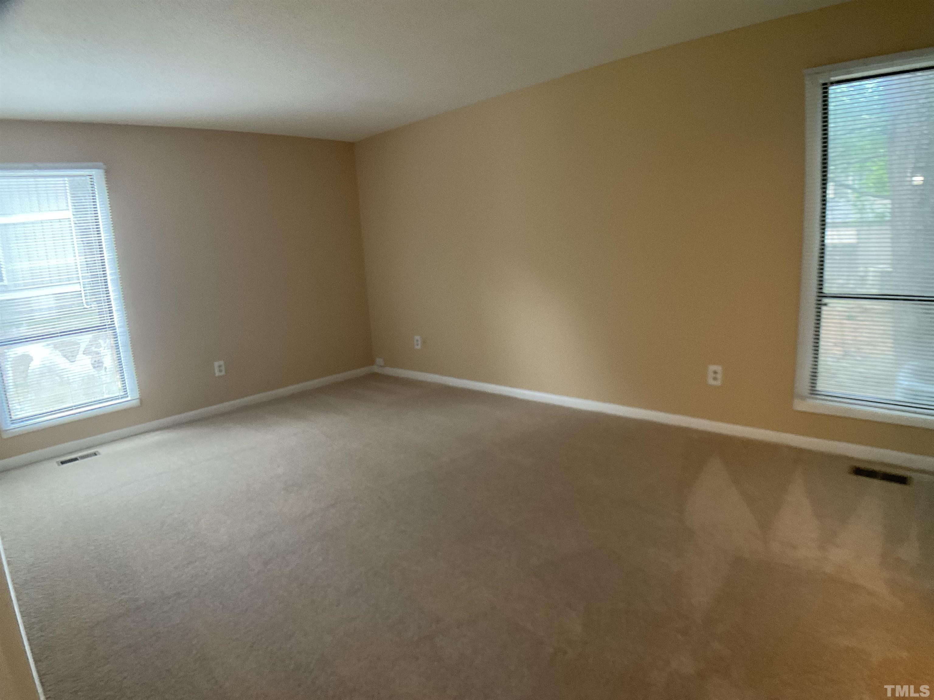 5812 Pointer Drive, Unit 101 Raleigh, NC 27609 - Photo 20 of 30 an empty room with windows