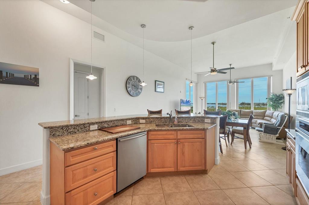 1375 Beach Road, Unit 311 Englewood, FL 34223 - Photo 12 of 51 a kitchen with a sink stove and cabinets