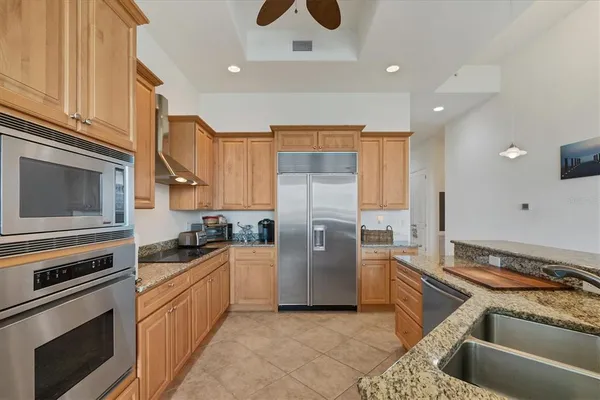 a kitchen with a sink stove and refrigerator