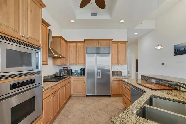 a kitchen with a sink stove and refrigerator