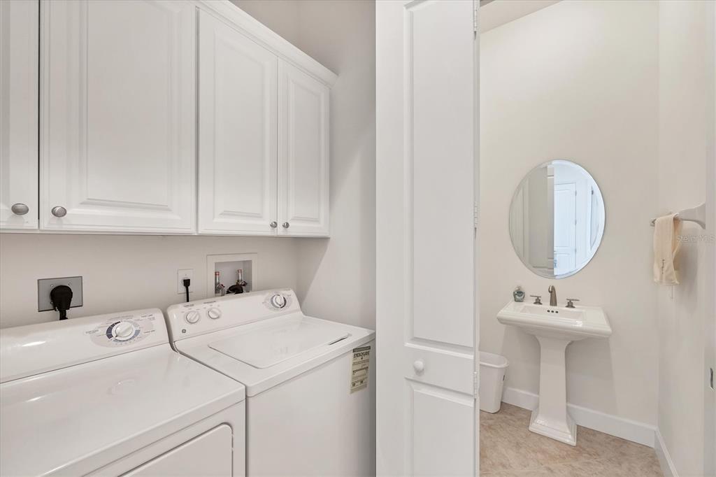 1375 Beach Road, Unit 311 Englewood, FL 34223 - Photo 26 of 51 a utility room with dryer and washer