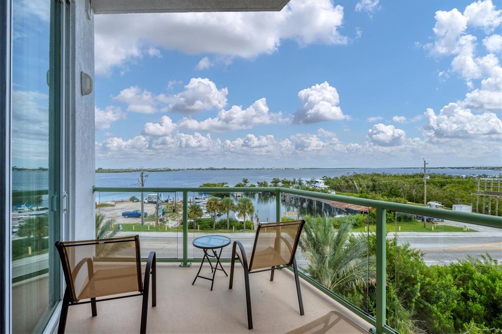 1375 Beach Road, Unit 311 Englewood, FL 34223 - Photo 28 of 51 a view of a chairs and table in patio