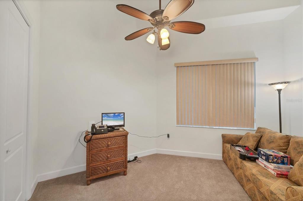 1375 Beach Road, Unit 311 Englewood, FL 34223 - Photo 30 of 51 a living room with furniture and a ceiling fan