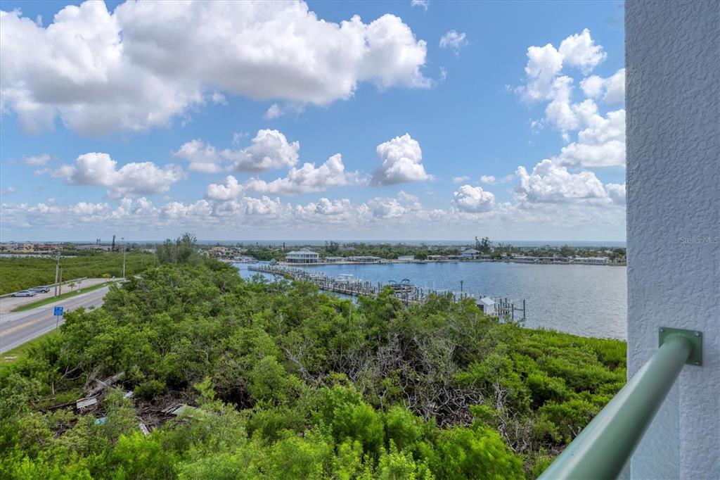 1375 Beach Road, Unit 311 Englewood, FL 34223 - Photo 31 of 51 a view of a lake in middle of forest