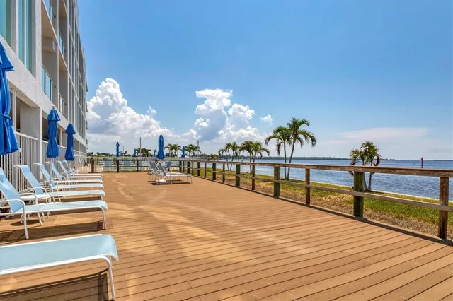 a view of a swimming pool with an outdoor seating
