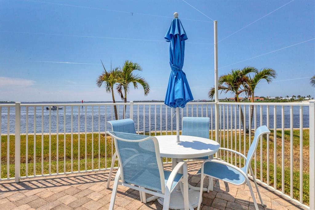 1375 Beach Road, Unit 311 Englewood, FL 34223 - Photo 40 of 51 a view of balcony with furniture and potted plant