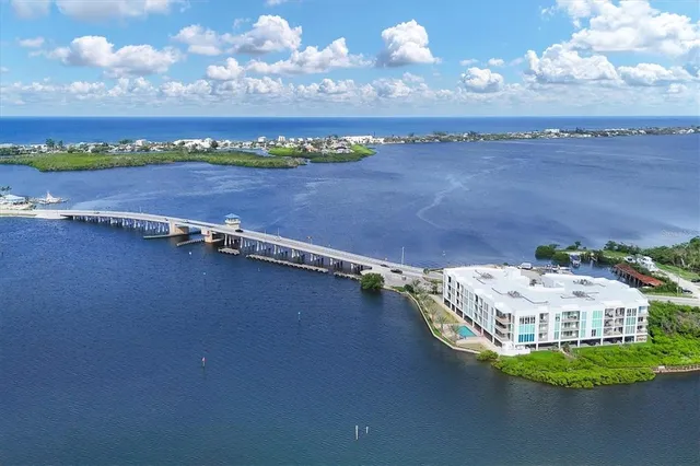 an aerial view of a house with a lake view