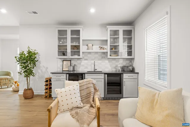 a living room with furniture window and potted plant