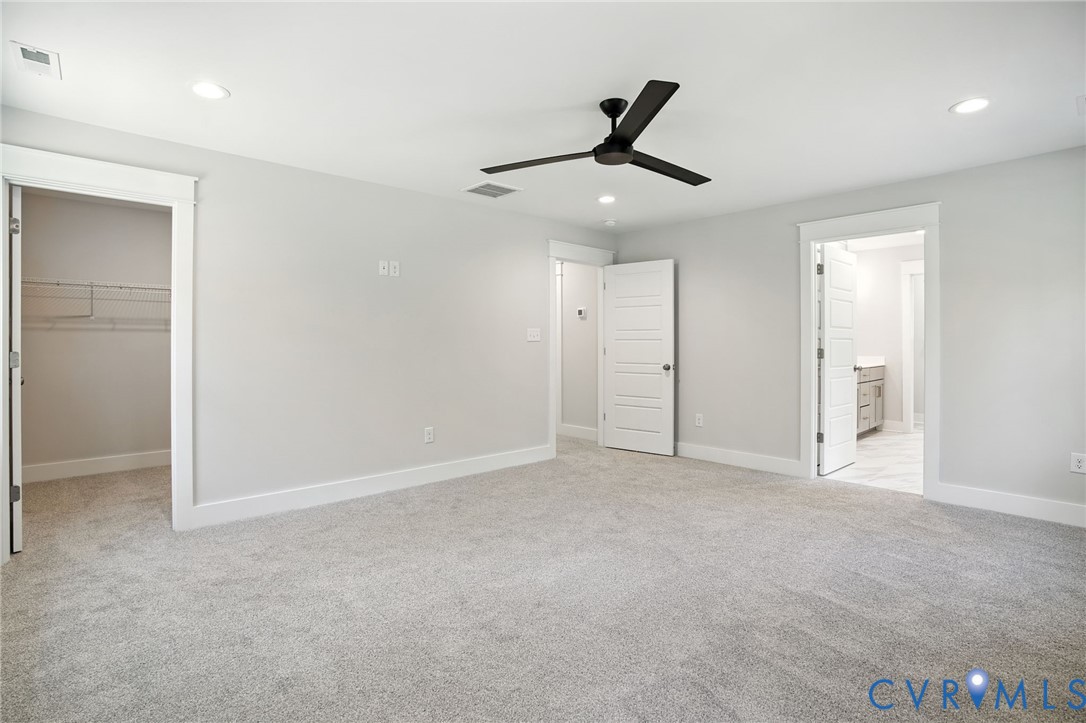 Tbd Lot 3 Rocky Ford Road Beaverdam, VA 23015 - Photo 27 of 40 an empty room with chandelier fan and windows