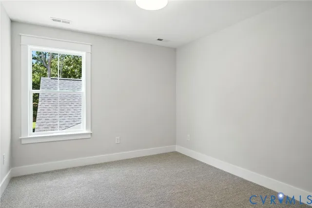 an empty room with closet area