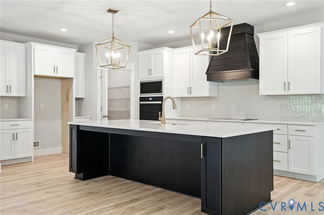 Tbd Lot 3 Rocky Ford Road Beaverdam, VA 23015 - Photo 9 of 40 a kitchen with stainless steel appliances granite countertop a sink a stove a refrigerator and island with wooden floor