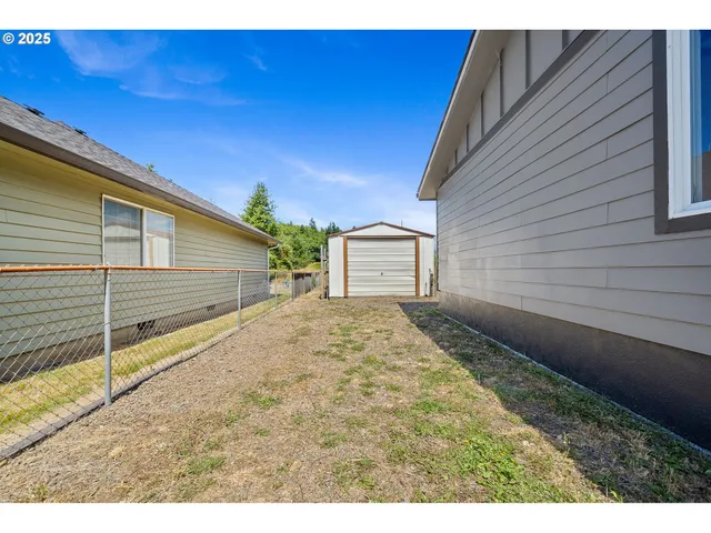 a view of a backyard of the house