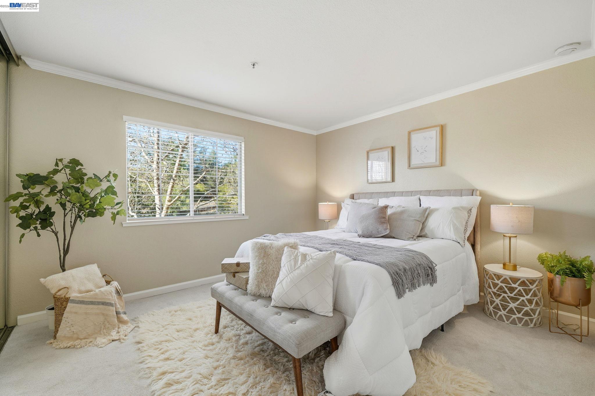 490 Bollinger Canyon Lane, Unit 367 San Ramon, CA 94582 - Photo 19 of 32 a bedroom with a bed and a potted plant