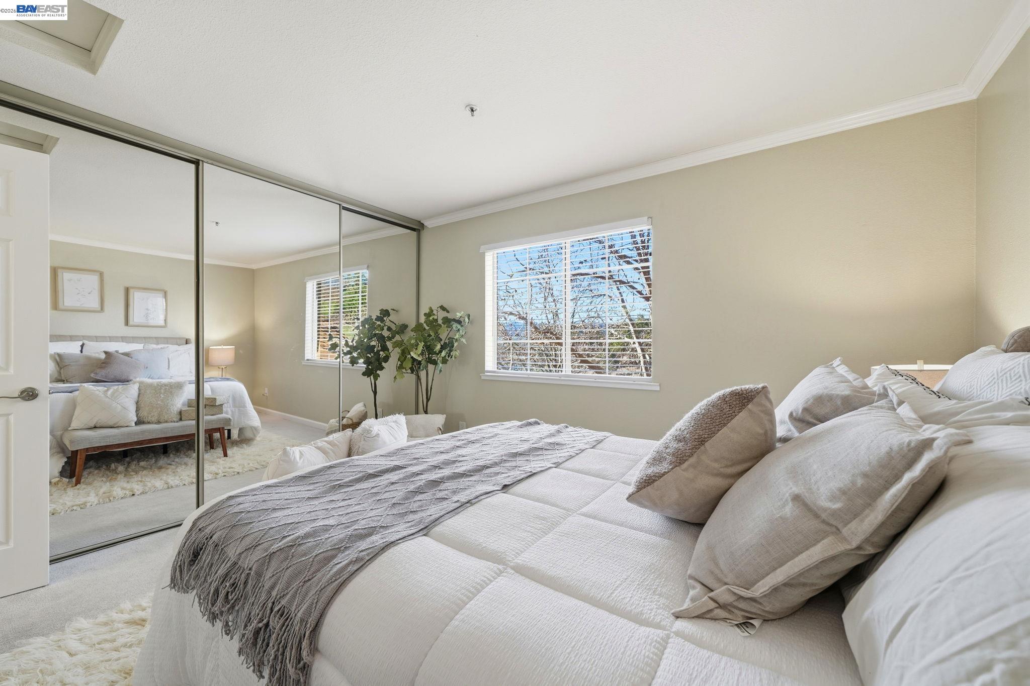 490 Bollinger Canyon Lane, Unit 367 San Ramon, CA 94582 - Photo 20 of 32 a bedroom with a large bed and a window